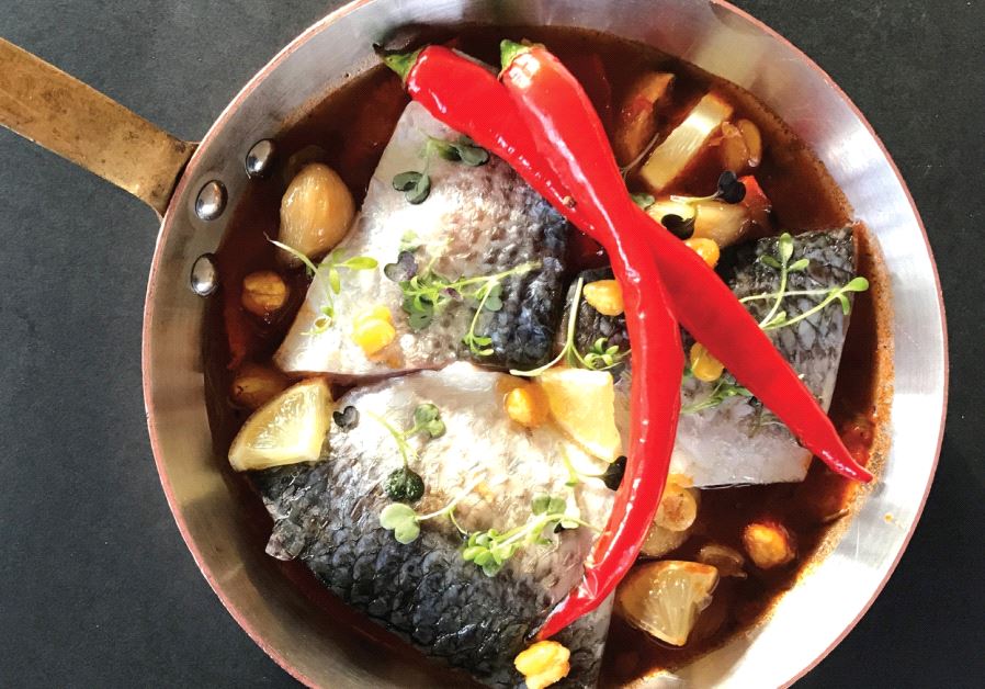 Sea bream chreime in a spicy tomato sauce with pickled lemons and crispy chickpeas