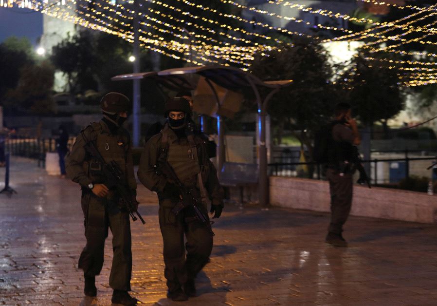 Israeli policemen secure the scene of the shooting and stabbing attack outside Damascus gate in Jerusalem's old city June 16, 2017