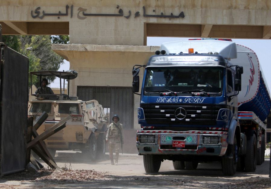 Egyptian soldiers stand guard at the border as fuel tankers enter Gaza through the Rafah border between Egypt and southern Gaza Strip June 21, 2017.