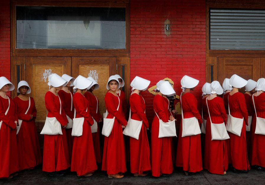 Women dressed as handmaids promoting the Hulu original series "The Handmaid's Tale" in Texas.