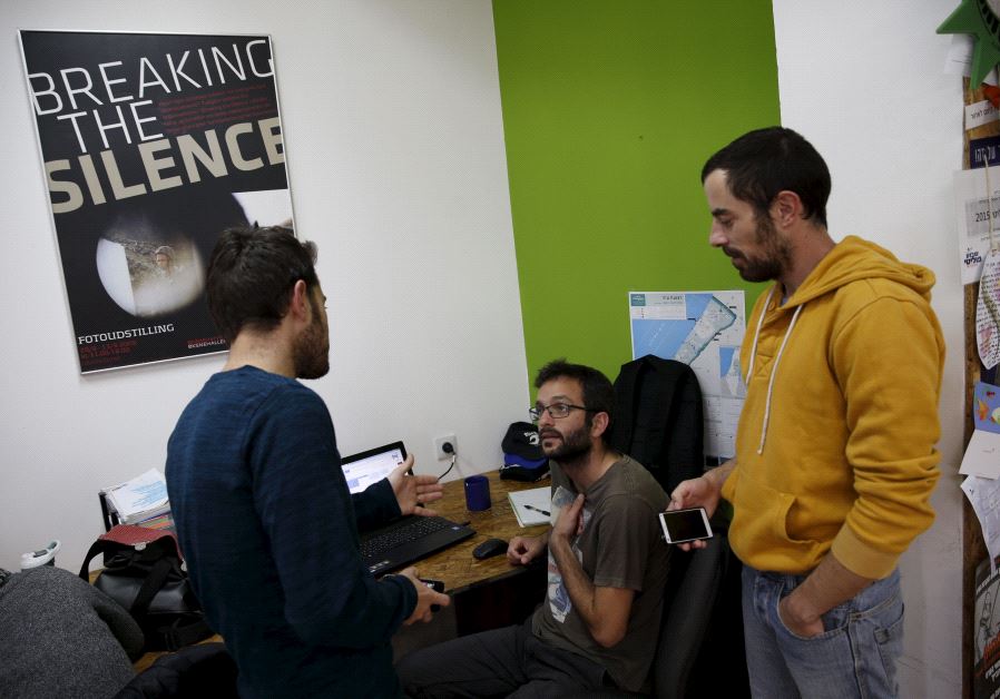 Employees work at the offices of "Breaking the Silence" in Tel Aviv, Israel, December 16, 2015