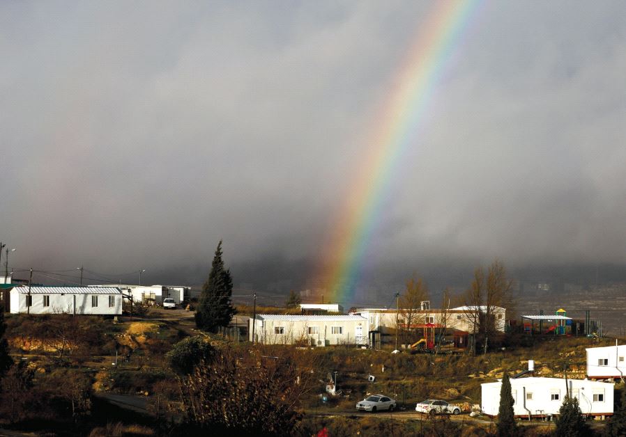 A rainbow is seen over the settler outpost of Amona earlier this year