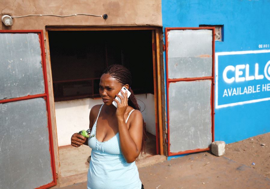 Woman in Africa talking on a smartphone