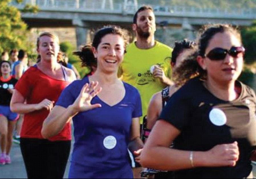 MEMBERS OF Runners Without Borders participate in a race in east Jerusalem in March
