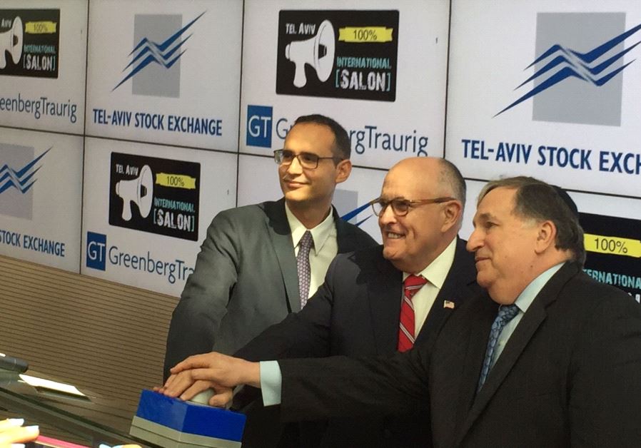 Rudy Giuliani (center) rings the opening bell at the Tel Aviv Stock Exchange, June 28 2017.