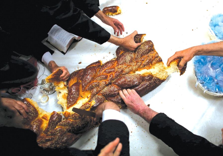 People eat Challah bread