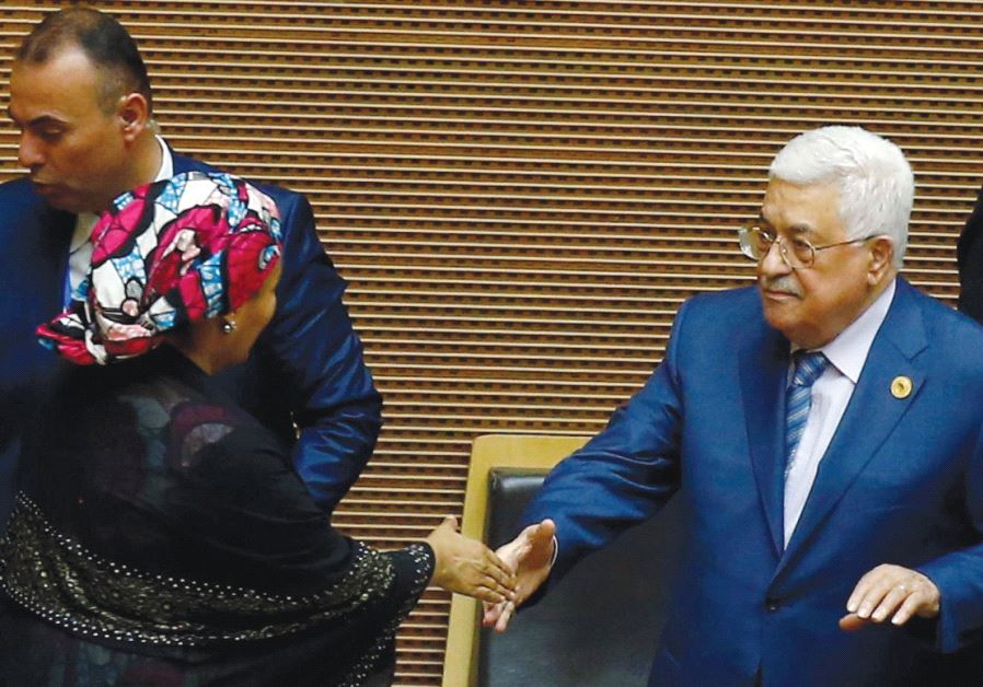 PALESTINIAN AUTHORITY President Mahmoud Abbas (right) is welcomed by UN Deputy Secretary-General Amina Mohammed at African Union headquarters in Addis Ababa yesterday
