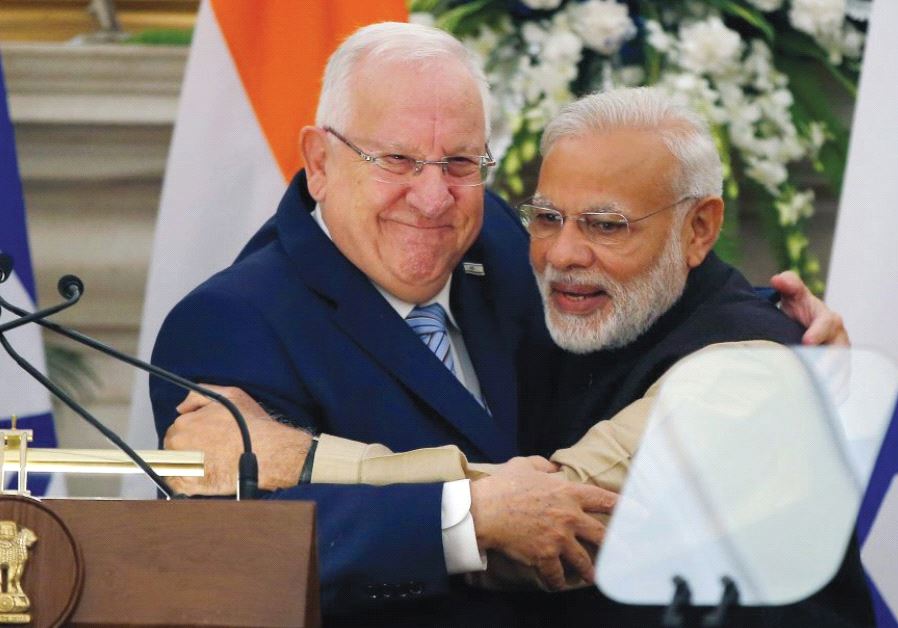 PRESIDENT REUVEN RIVLIN receives a bear hug from Indian Prime Minister Narendra Modi during Rivlin’s visit to India last November