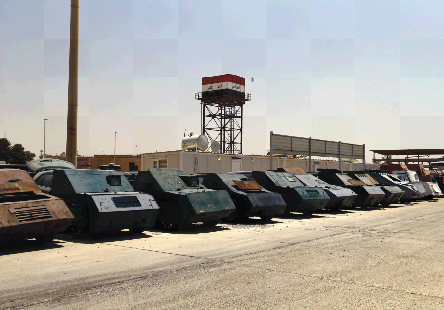 SPOILS OF war. Islamic State vehicles captured by the Iraqi army.