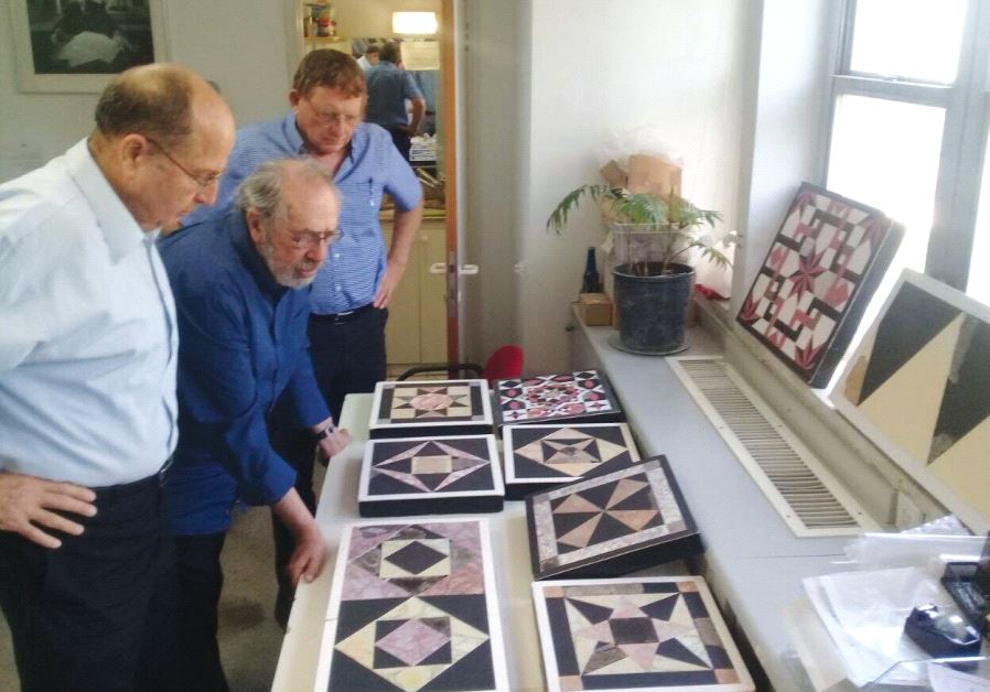 Archeologist Dr. Gabriel Barkay (center) inspects Second Temple-era ‘opus sectile’ floor tiles from the Temple Mount, in the presence of Moshe Ya’alon (right)