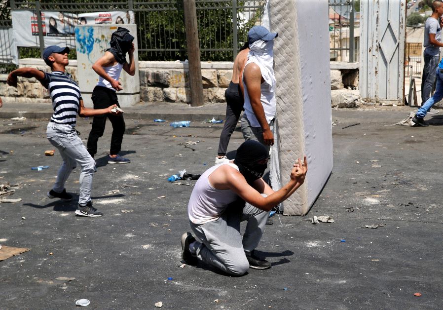 Palestinians clash with Israeli security outside the Old City of Jerusalem