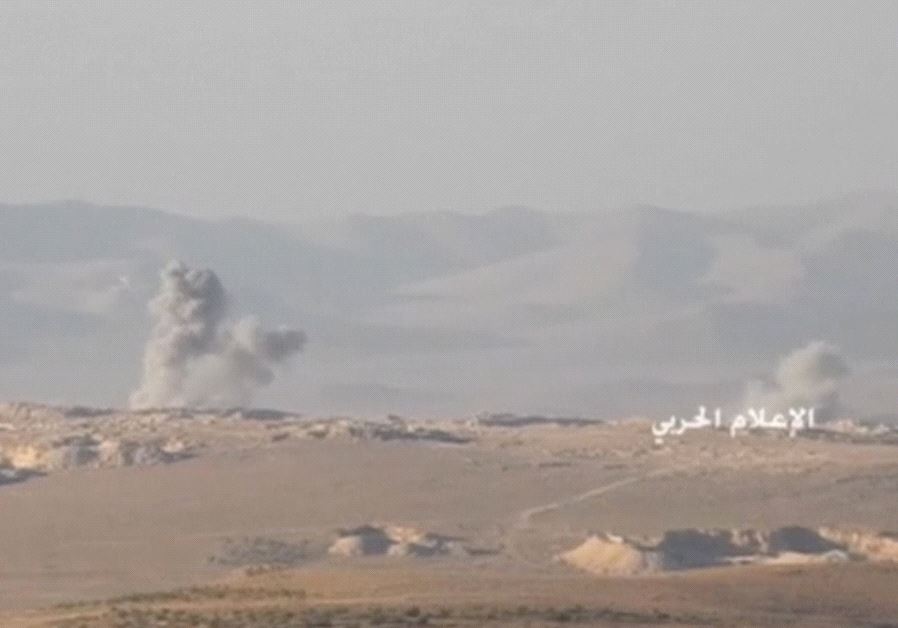 A still image taken on July 21, 2017 from an undated footage by Hezbollah Military handout shows smoke rising at an unidentified location at the Syrian-Lebanese frontier. 