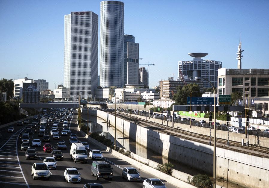Vehicles drive on a highway in the central Israeli city of Tel Aviv December 17, 2013. 