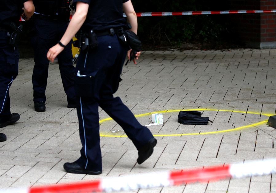 Police outside the Hamburg supermarket where a man attacked shoppers, July 2017