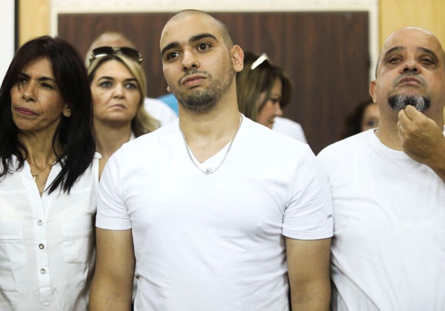 Former Israeli soldier Elor Azaria (C), who was convicted of manslaughter and sentenced to 18 months imprisonment for killing a wounded and incapacitated Palestinian assailant, waits to hear the ruling at an Israeli military appeals court in Tel Aviv, Israel July 30, 2017. 