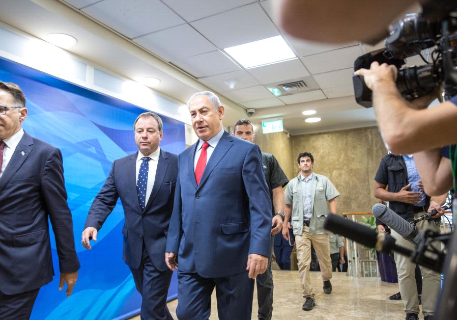 Prime Minister Benjamin Netanyahu enters a security cabinet meeting, August 2017